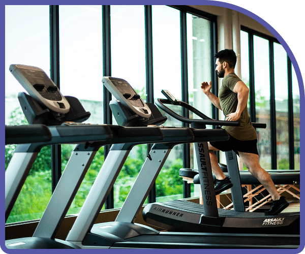 Athlete training on a treadmill in a modern fitness studio